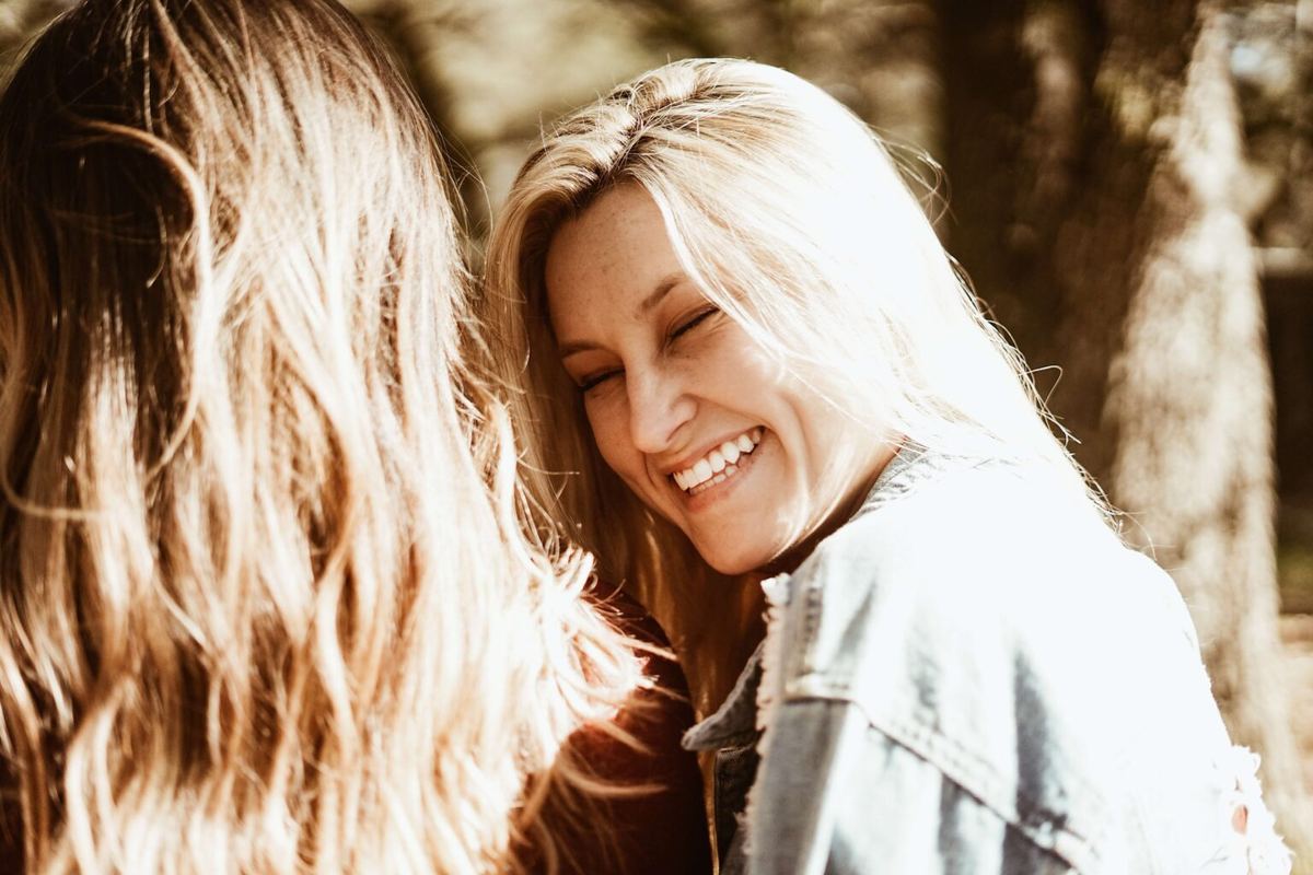 Woman smiling at another woman
