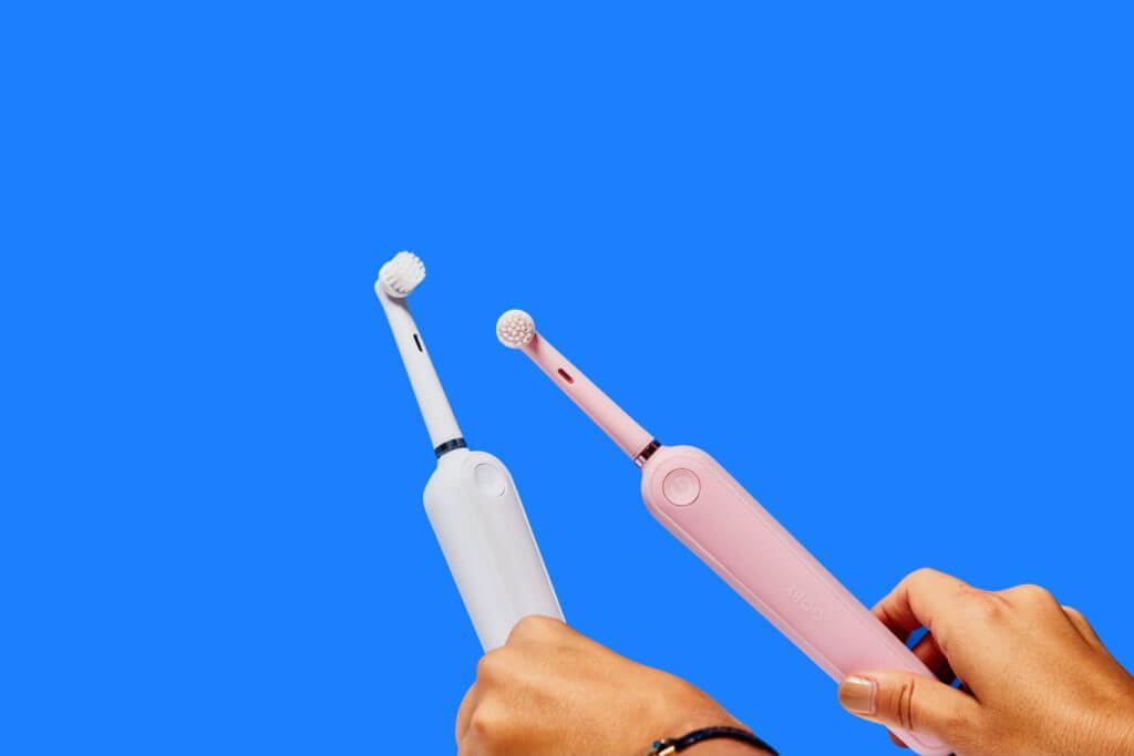 Holding electric and regular toothbrush