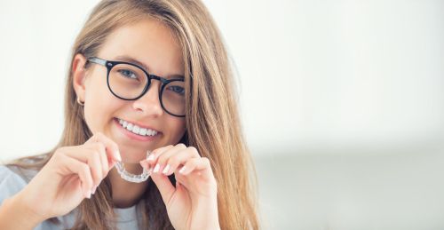 woman showing invisalign