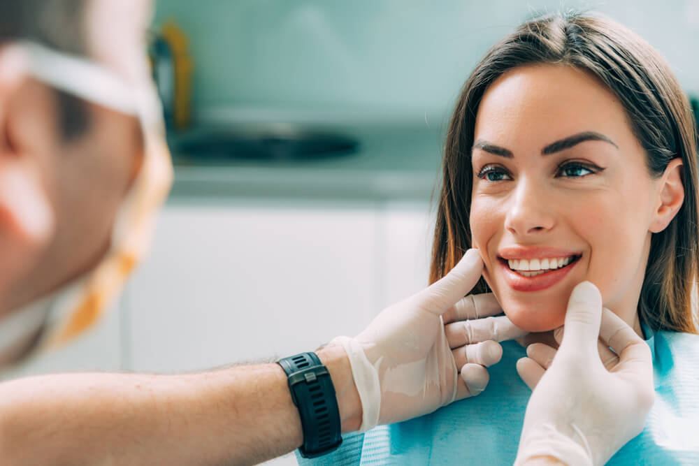 Woman being inspected by her dentist and choosing her Cosmetic Dentistry Treatment