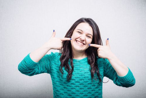 girl smiling showing her teeth