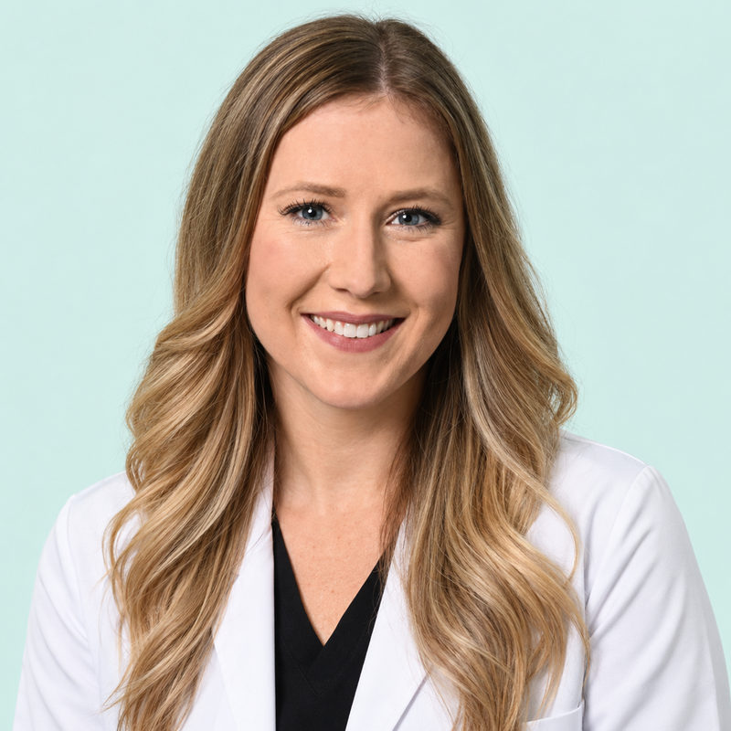 Portrait of Dr. Andrea Bakke in a white coat